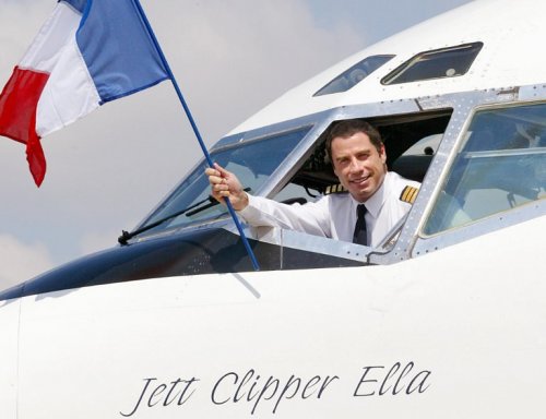 John Travolta waving to the crowd out of his Boeing 707 Jett Clipper Ella.